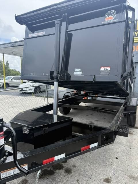 Hydraulic dump trailer raised for debris cleanup in Hollywood FL